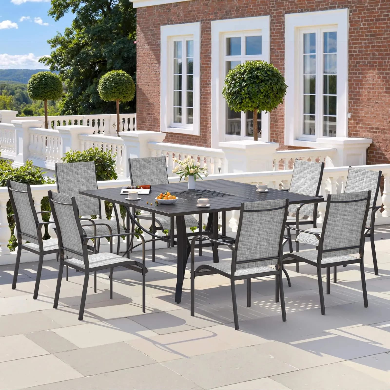 Gray nine-piece patio dining set with table, chairs, and umbrella hole