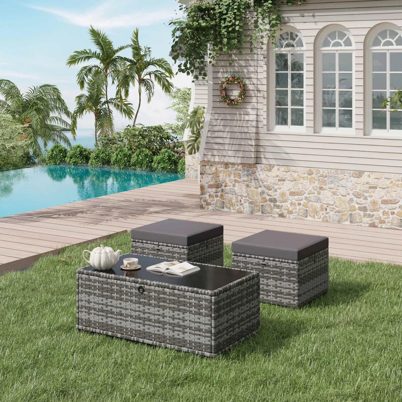 Gray three piece patio furniture set with two ottomans and side table